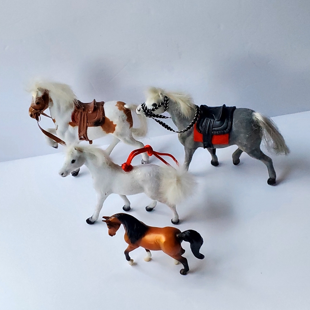 Flocked vintage horses.Three are flocked 1 is a Breyer Reeves